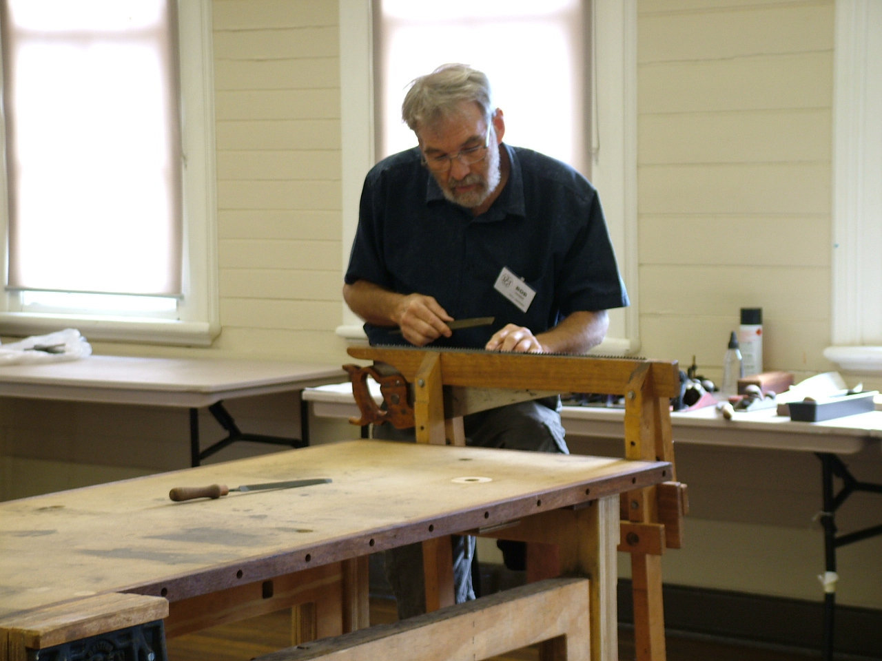 Bob Crosbie filing a saw